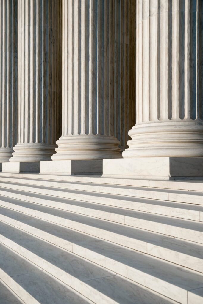 Courthouse columns and steps in sunlight