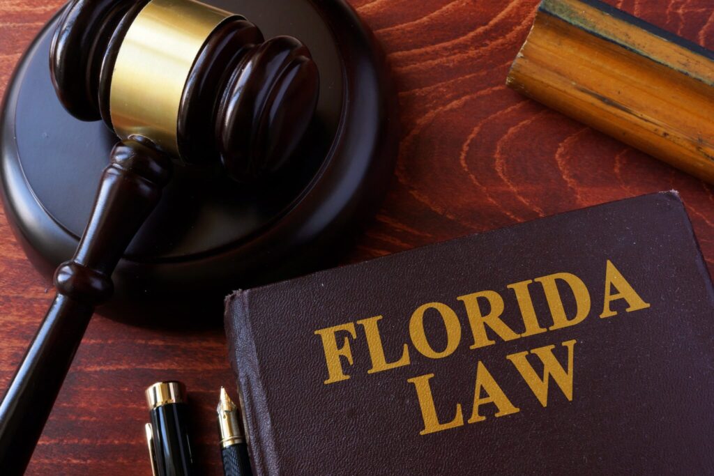 Florida Law book and wooden gavel on a desk
